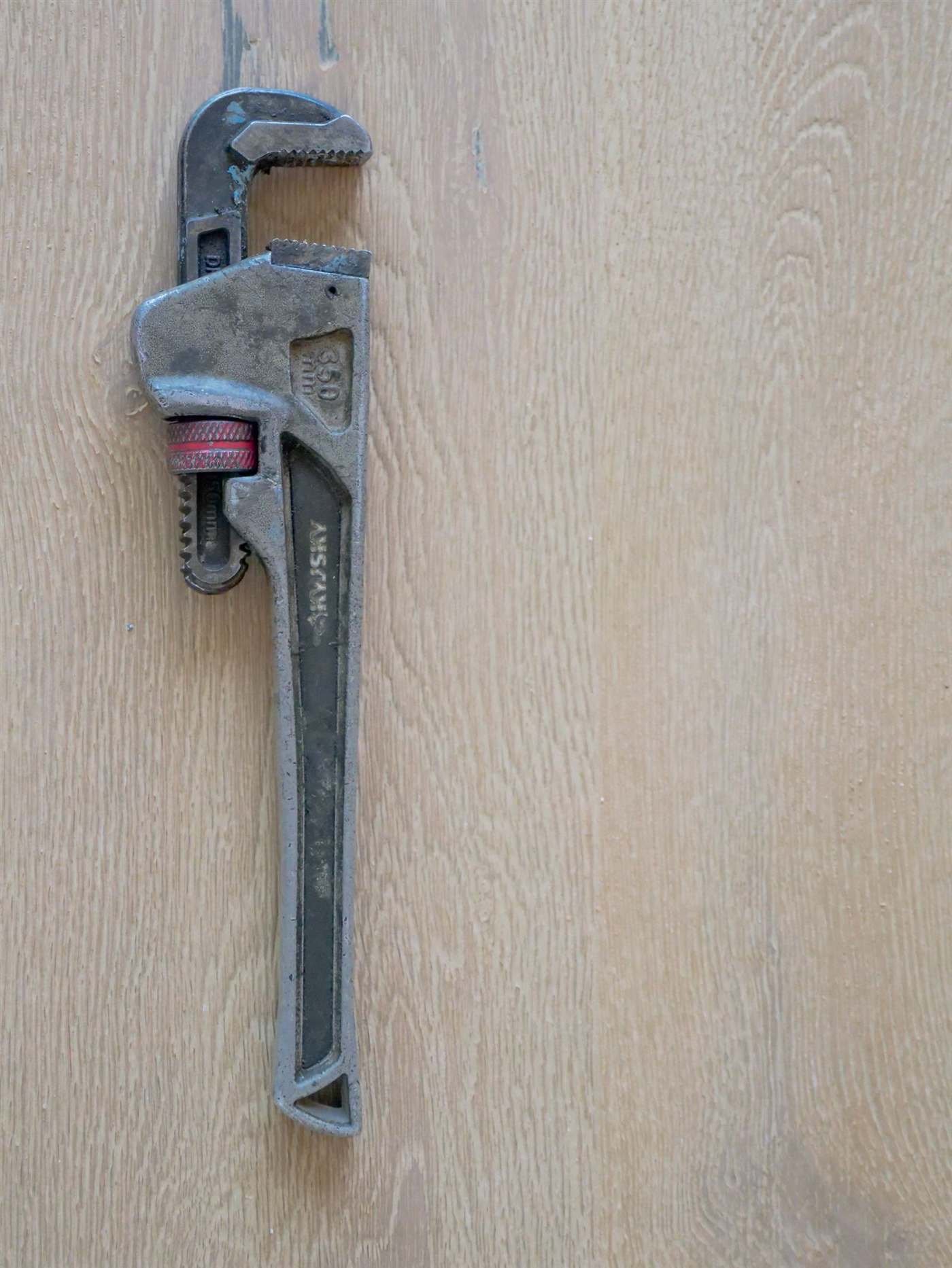 Plumber's pipe wrench used for leak detection and pipe repair, Chicago