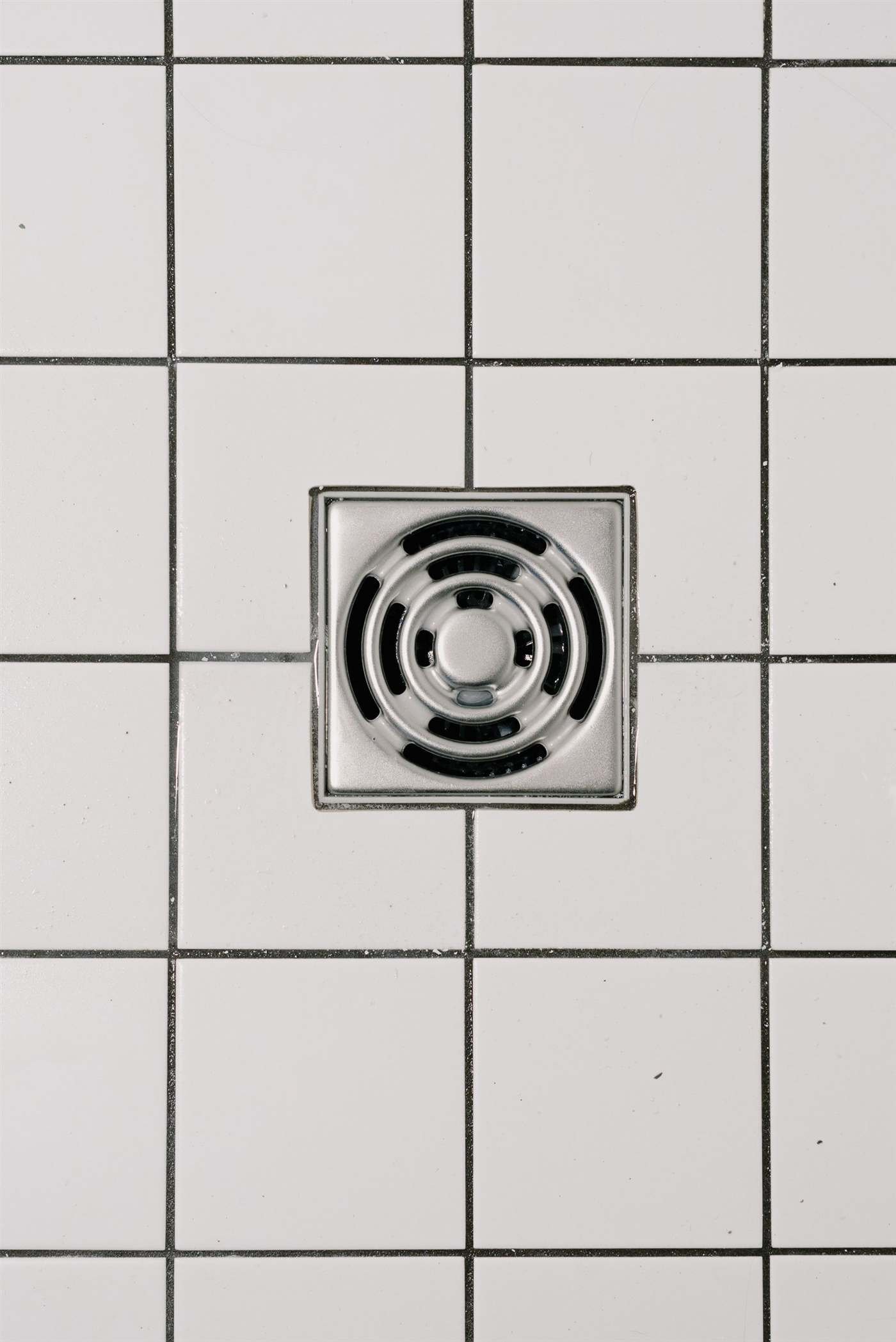 Clean tiled shower drain after professional drain cleaning service, Chicago